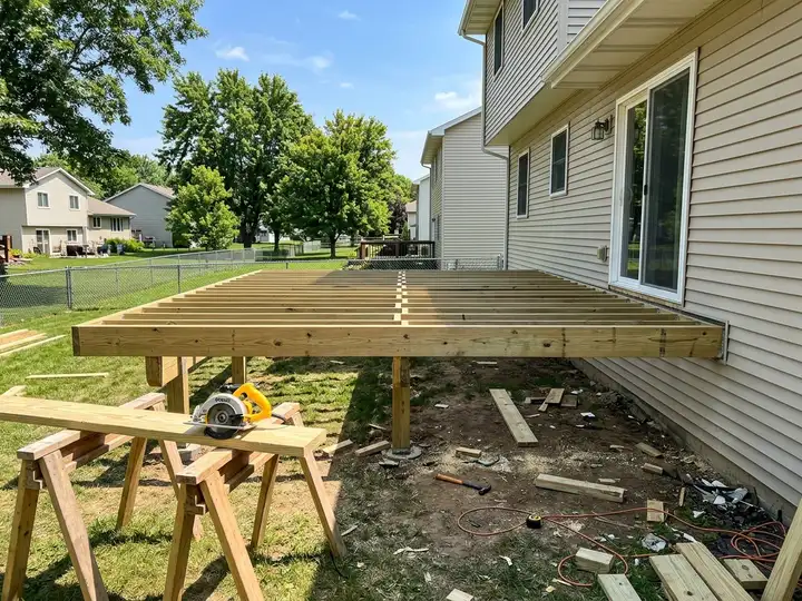 Jobsite photo of a deck frame under construction
